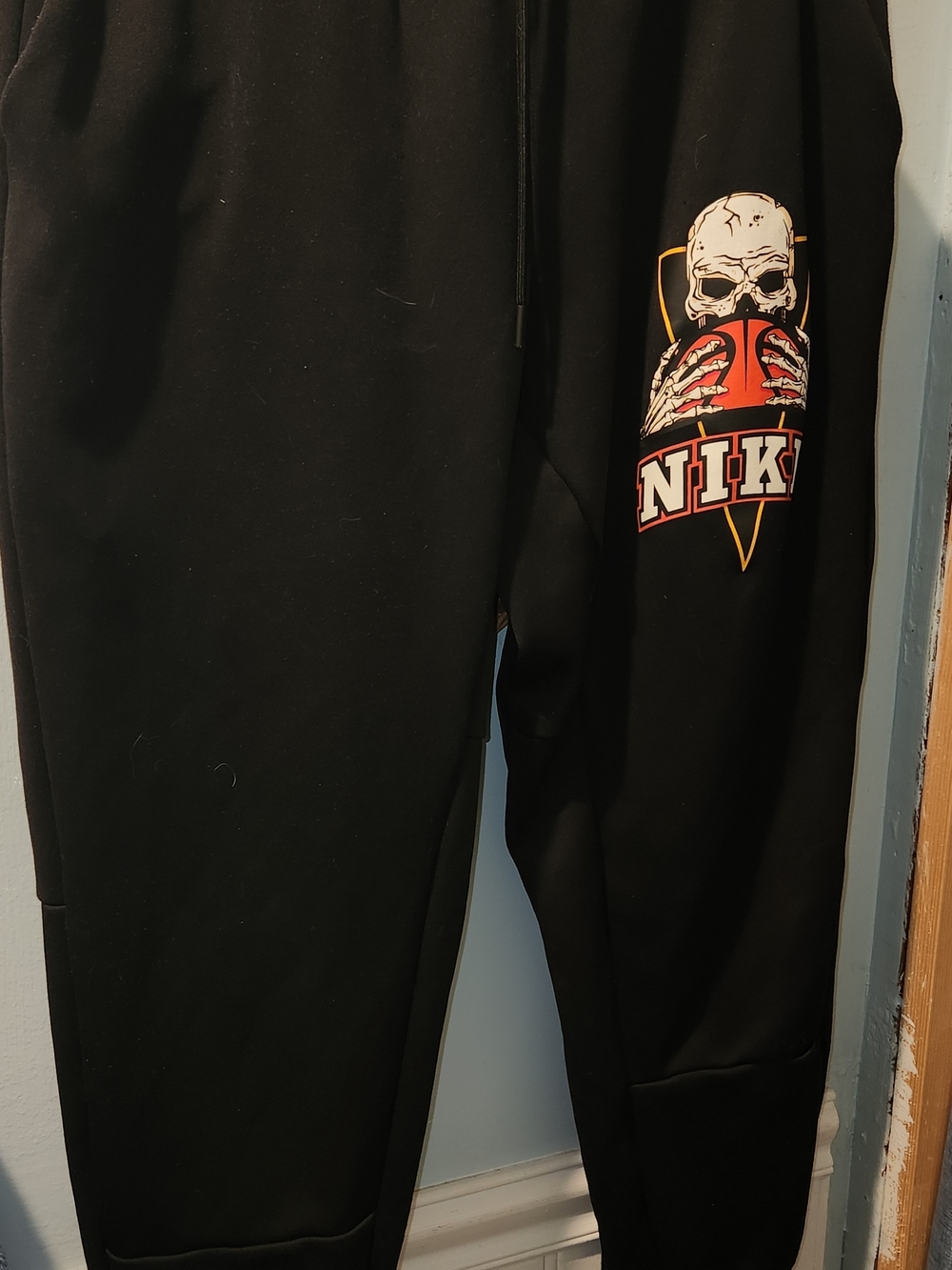 Nike Black Joggers with Skull & Orange Basketball Graphic